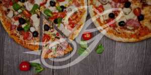 Discover Genova's To Go pizzas website banner featuring a delectable pizza covered in a medley of mouthwatering toppings.