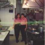 vintage image of employees from Genova's To Go in back kitchen.