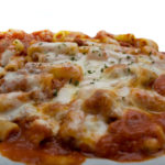 Flavorful baked ziti served with homemade meat sauce and melted mozzarella cheese from Genova's To Go.
