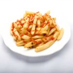 Plate of french fries with ketchup, served at Genova's To Go. A delicious snack to satisfy your cravings!