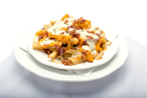 Plate of Cheecho Fries: Crispy golden french fries covered in melted cheese and crispy bacon bits from Genova's To Go.