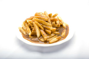 A plate of Genova's To Go gravy fries - a delicious combination of french fries with gravy and sauce. Yum!