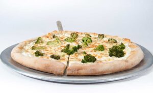 A flavorful pizza from Genova's To Go adorned with broccoli, ricotta, and a white sauce.