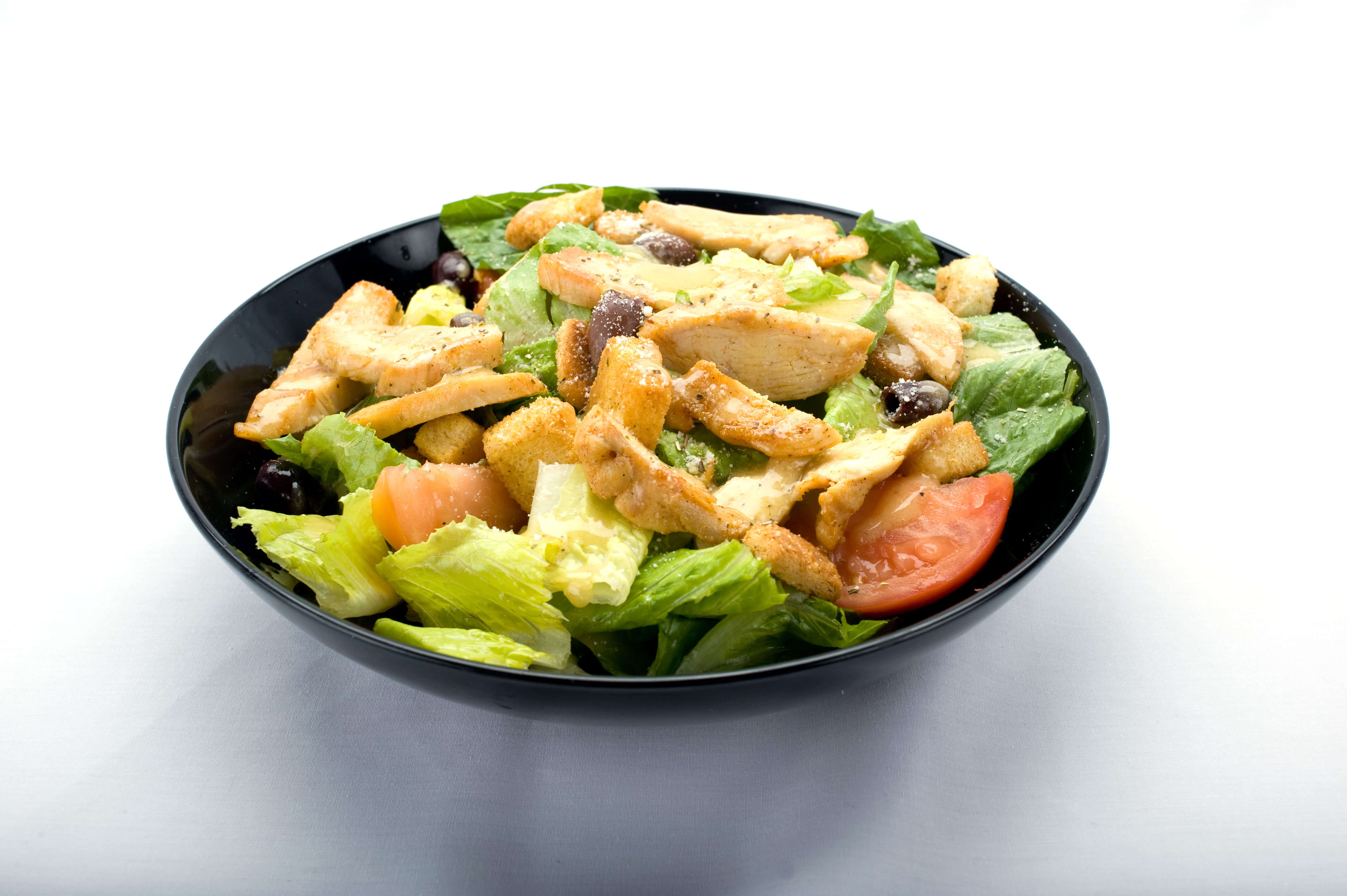 Chicken Caesar Salad from Genova's To Go: Fresh greens, grilled chicken, and creamy Caesar dressing.