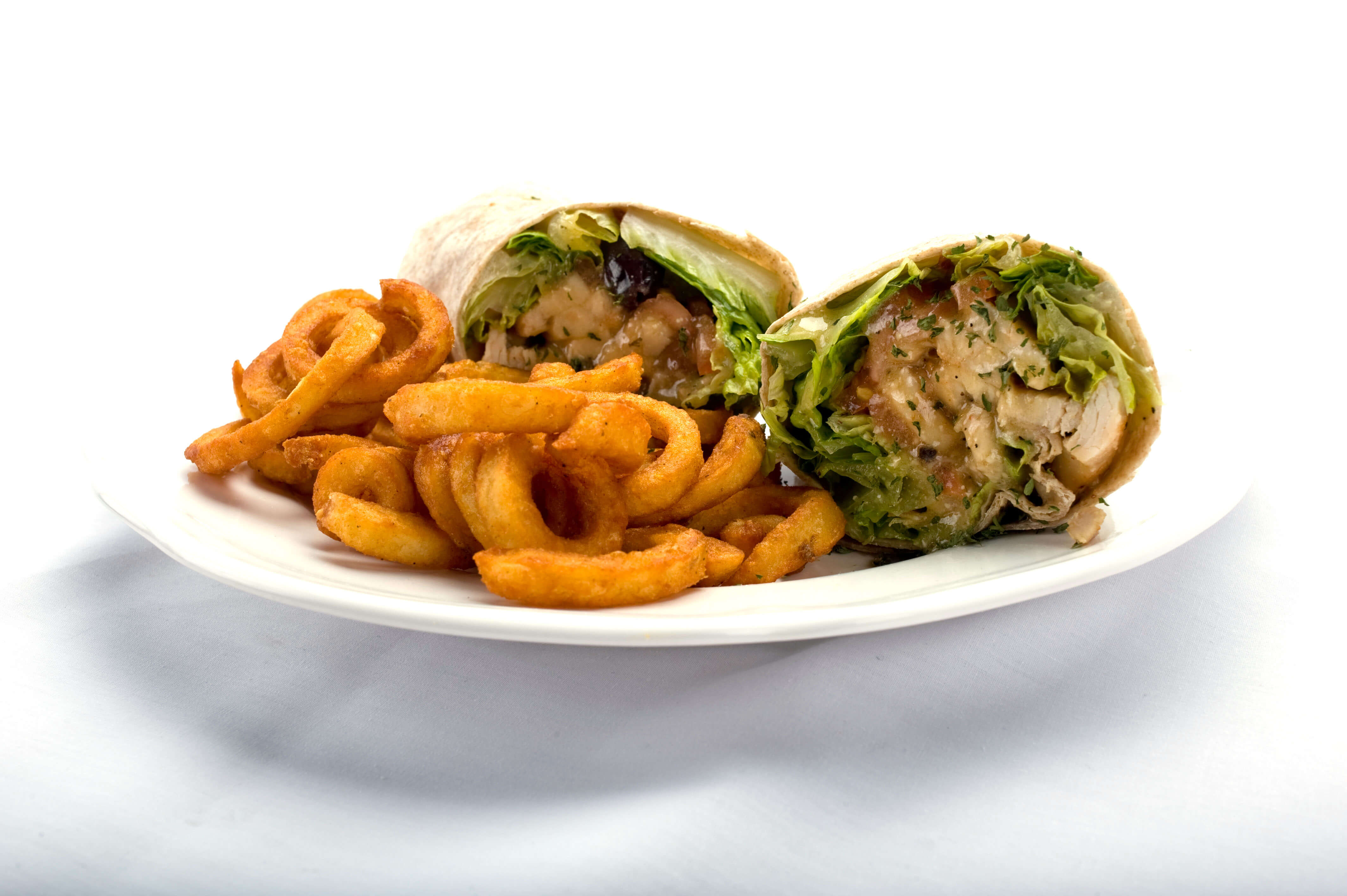 Chicken Caesar wrap with curly fries