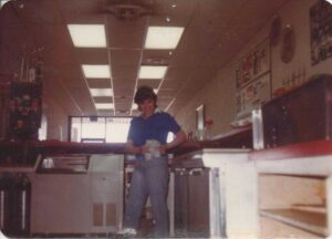 Vintage image of front end worker from Genova's To Go.
