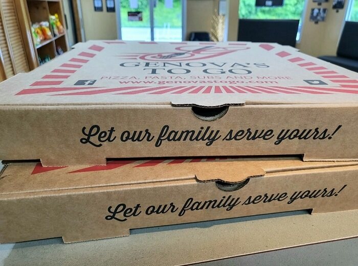 Two Genova's To Go pizza boxes stacked on top of each other, ready to satisfy your cravings.